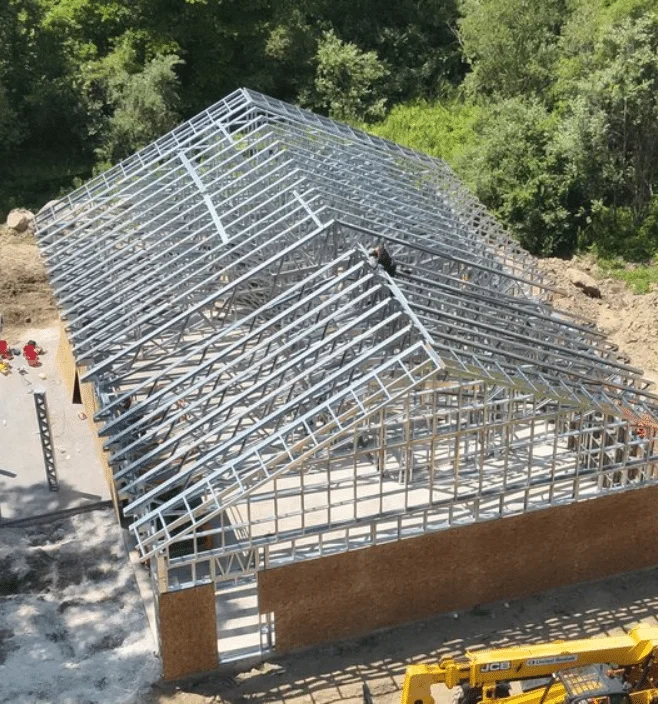 Aerial view of steel frame barndominium construction in Texas